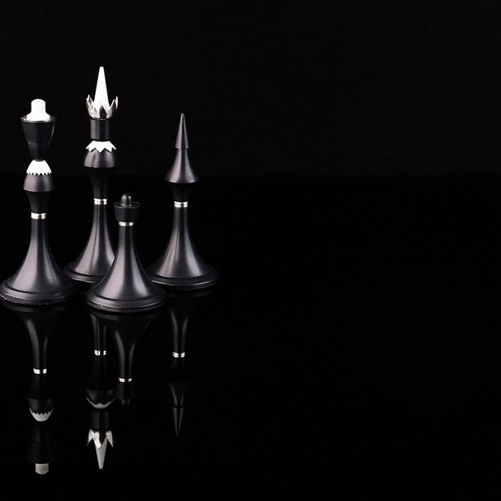 Chess Pieces Representing Victory and Strategy in Black and White 